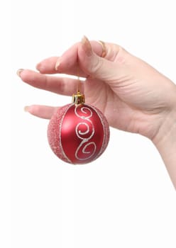 Red New Year's toy in female hands