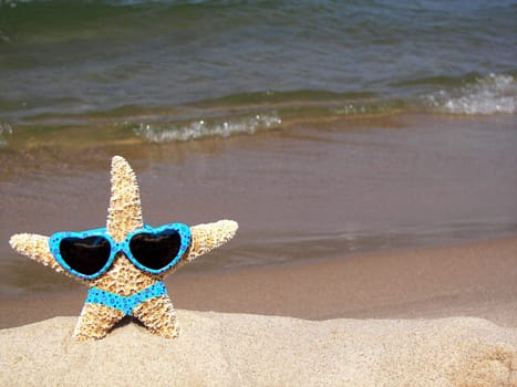 Cute starfish wearing a bikini and sunglasses.