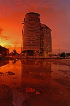 sunset, tree and modern building in the parks