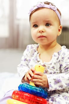 Baby plays with toys