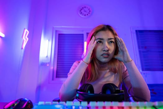 Game losing. Angry Gamer fail plays online video games tournament with computer, Unhappy upset woman wear gaming headphones she lose after playing live stream games online feel depressed at home