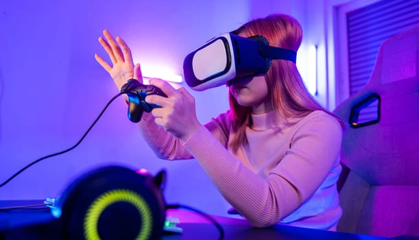 Gamer in VR headset glasses exploring metaverse plays online video game touching something on air and hold joystick, Excited woman playing watching video life simulation at home