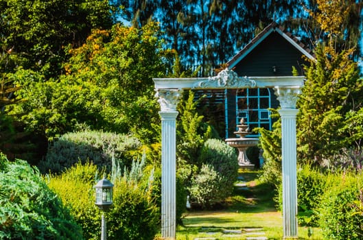 Stunning Entrance Portico Gate classic style decoration of a Public Garden. Column Stone structure element in classic architecture detail
