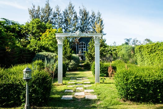 Stunning Entrance Portico Gate classic style decoration of a Public Garden. Column Stone structure element in classic architecture detail