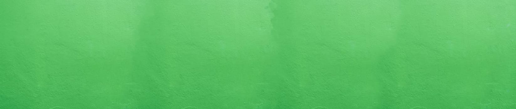 Panoramic Wide angle Vintage textured stucco wall background. green stucco wall. Background of a green stucco coated and painted exterior, rough cast of cement and. Abstract  wall grunge stone.