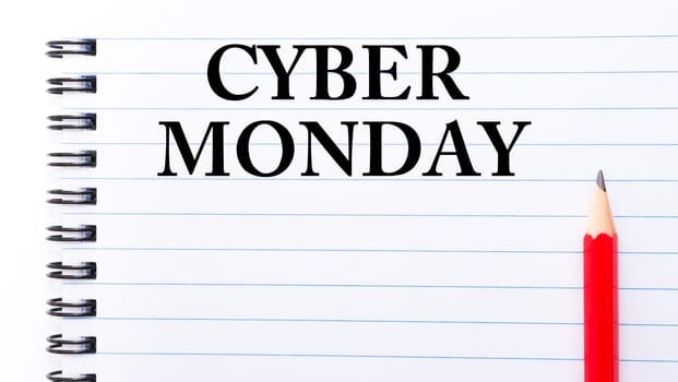 Cyber Monday Text written on notebook page, red pencil on the right. Concept image