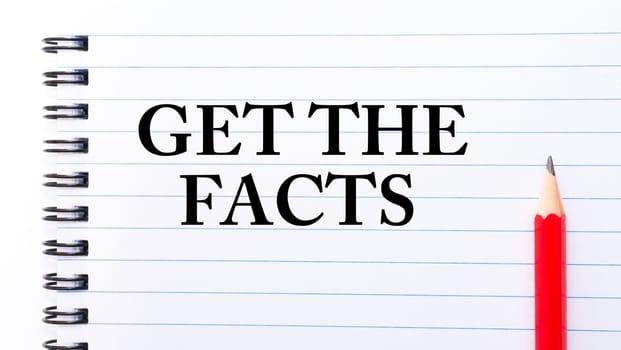 Get The Facts Text written on notebook page, red pencil on the right. Motivational Concept image