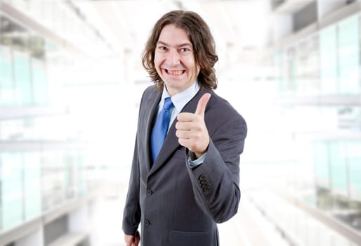 young business man going thumb up at the office