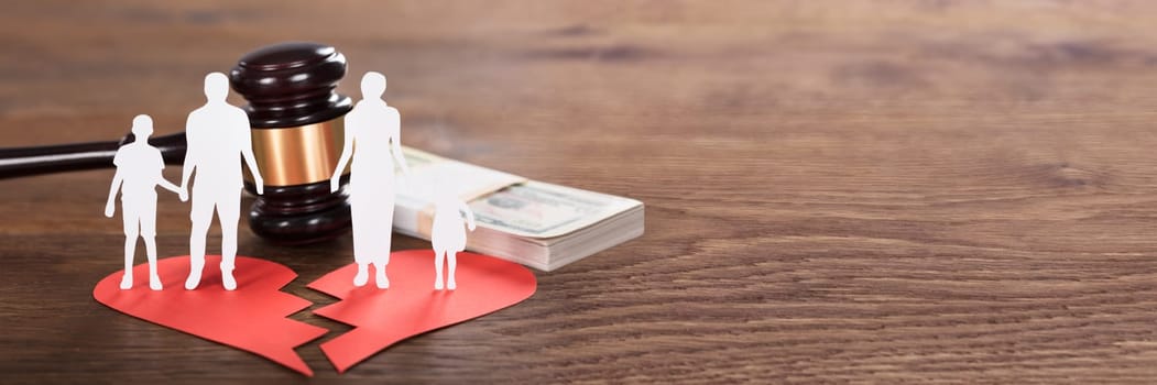 Gavel And Paper Family Representing Divorce On Wooden Desk