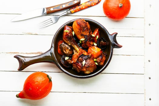 Chicken marinated meat in soy ginger sauce. Chicken legs fried with pumpkin and mushrooms.