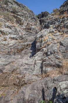 La Desespera waterfall. Rocky dry bed at summer season, Piornal, Caceres, Extremadura, Spain