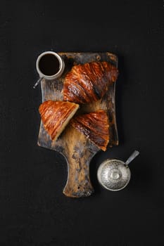 Top view of classic breakfast with croissant and coffee