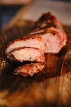 Closeup view of grilled juicy and spicy duck breast steak (photo with shallow depth of field)
