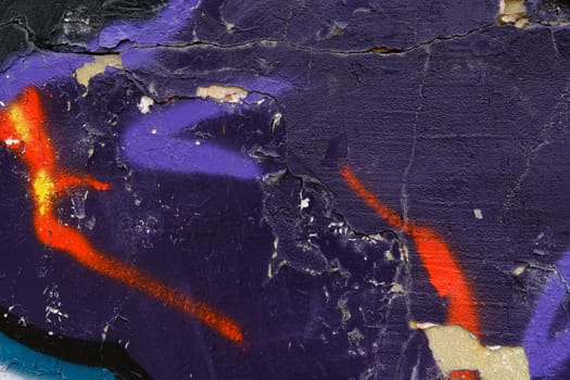 Colorful wall background with damaged paints of blue.