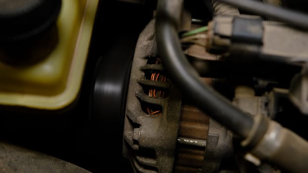 closeup car timing belt in car with working engine.