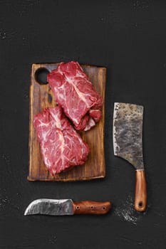 Overhead view of raw fresh lamb boneless neck meat on cutting board