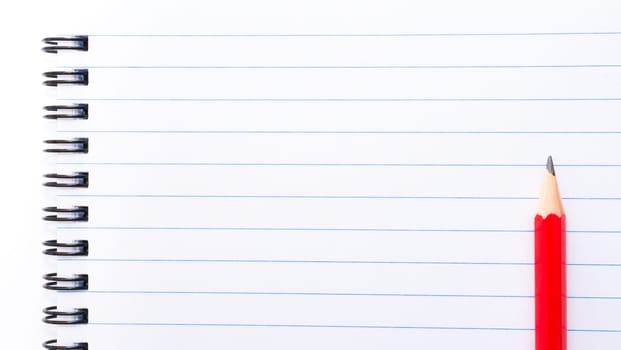 White blank  notebook page with red pencil on the right, with copy space available
