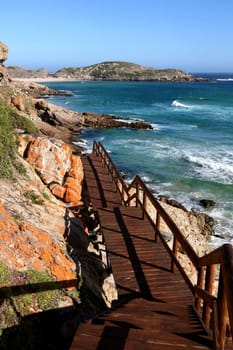 Wooden walkway and coastline at the Robberg near Pletternberg Bay  in South Africa