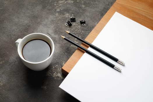 Blank stationery set. Blank letterhead, pencils, coffee cup and clips.
