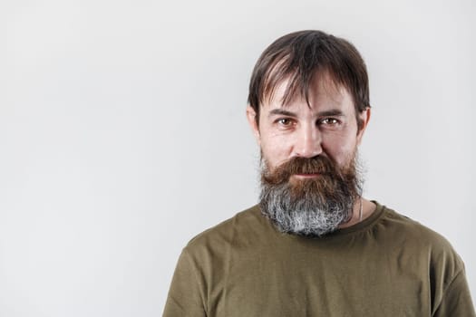 Studio portrait of a bearded man. Copy space for text.