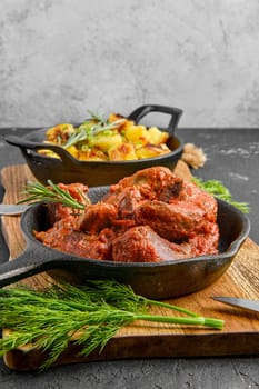 Lamb tongue baked in oven in cast iron pan