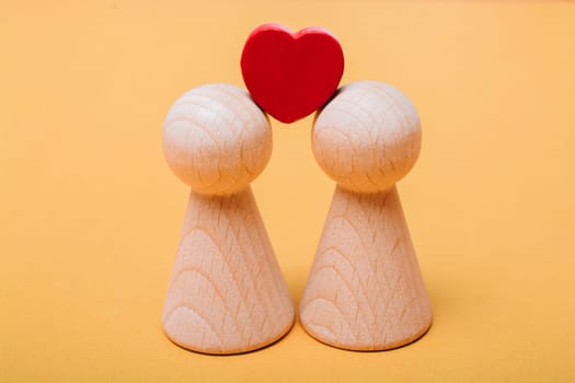 Wooden figurines of  family as concept of caring for children