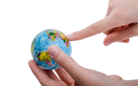 Child holding a small globe in hand on white background