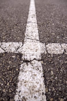 Marking lines on the asphalt, information sign