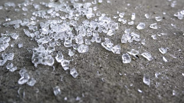 Detail of broken glass in the garbage, danger due to cuts