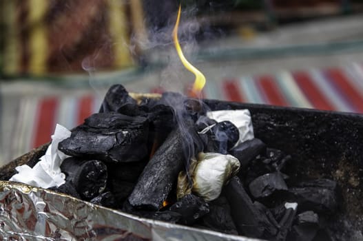 Detail of burning charcoal in a barbecue for cooking