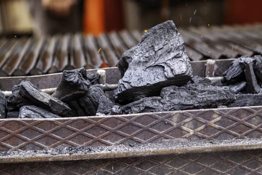Detail of burning charcoal in a barbecue for cooking