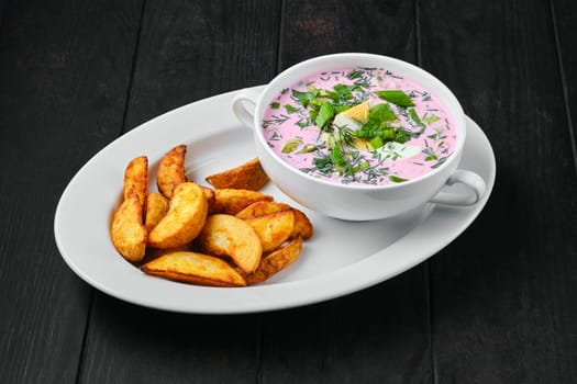 Cold beet soup with potato wedges on a plate
