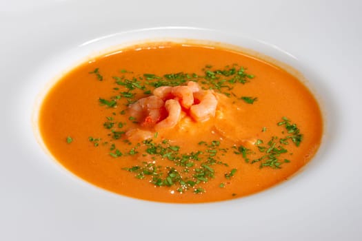 closeup view of plate of soup with shrimps