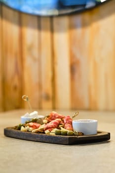 Plate with snack for wine (soft focus photo with shallow depth of field)