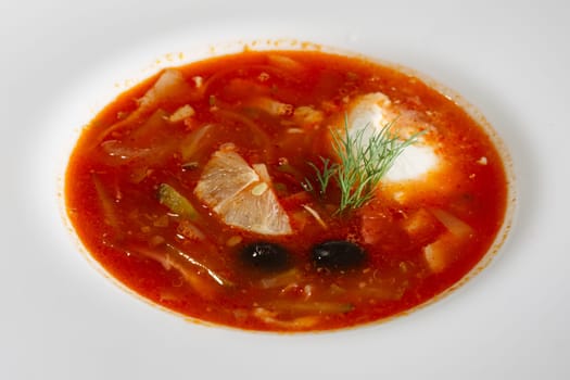 Traditional russian solyanka soup, closeup view