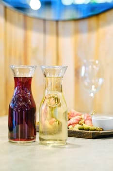 Two decanters with wine and plate with snack on background (soft focus photo with shallow depth of field)