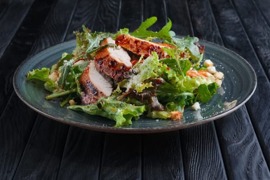 Fried chicken fillet with vegetables and salad dripped with vinegar sauce