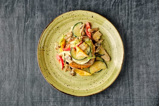 Potato pancakes with chicken, mushrooms, bell pepper and zucchini.
