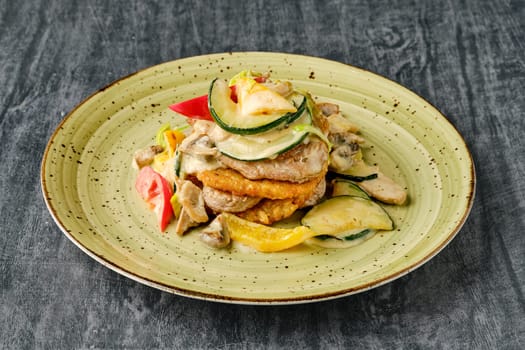 Potato pancakes with chicken, mushrooms, bell pepper and zucchini.