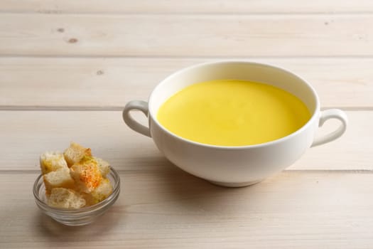 Chicken soup puree with white bread chips