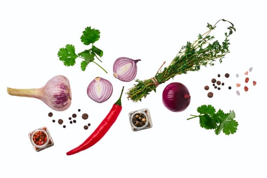 Top view of variety of spice isolated on white background. Garlic, thyme, red onion, pepper, chilli, salt.