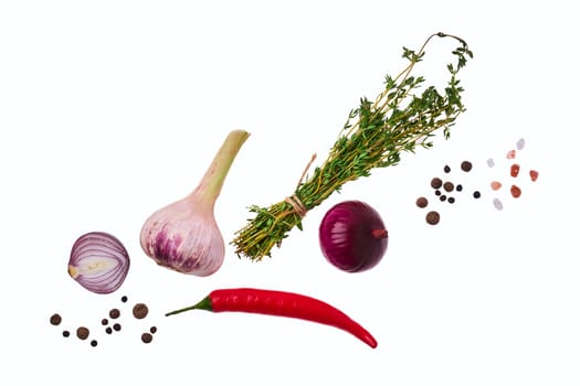 Top view of variety of spice isolated on white background. Garlic, thyme, red onion, pepper, chilli, salt.