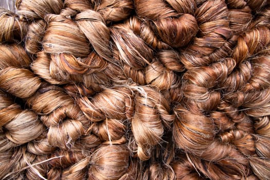 Thick Golden bundle of Wet raw jute fiber Texture Background. Golden  fiber texture background