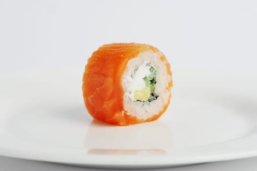 smoked salmon roll with cheese on white background