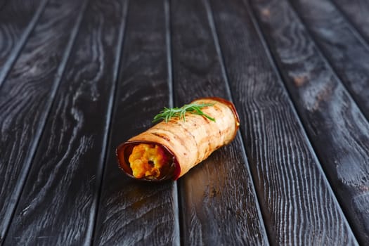 Appetizer for reception. Eggplant stuffed with fried carrot, onion, cheese and egg