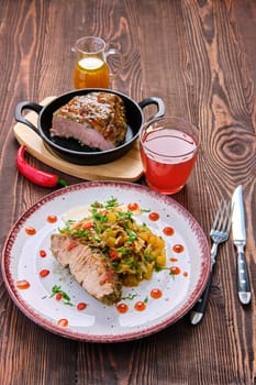oven-baked meat with braised cabbage and zucchini and hot spicy sauce