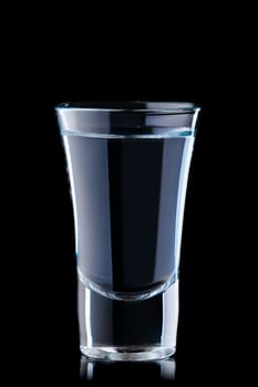 Shot with vodka isolated on black background