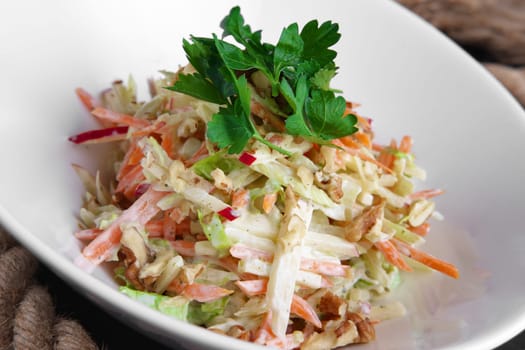 Salad with radish, carrot, tomato and walnut
