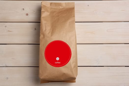 Big coffee paper pack on wooden table. Top view.