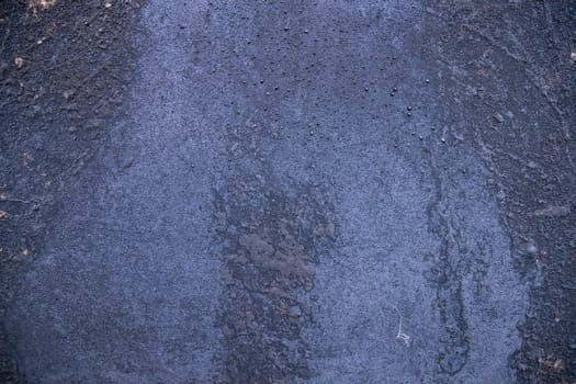 Old metal surface covered black ash  abstract background texture
